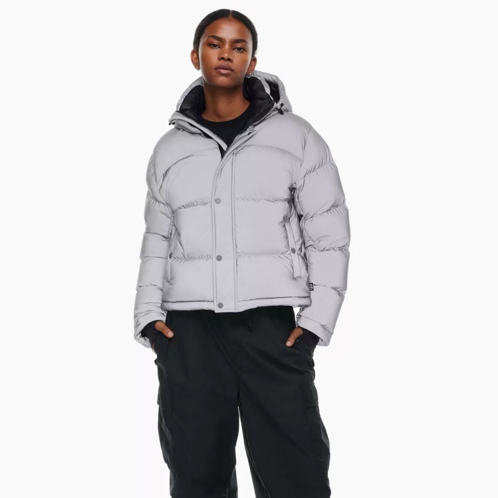 The Aritzia Super Puff Shorty in the Reflective Silver Color